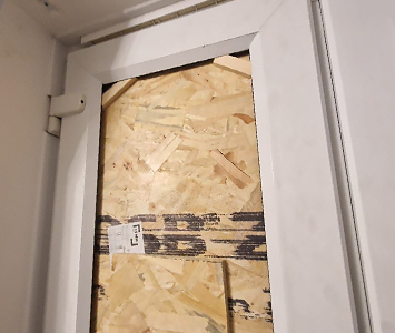 uPVC door boarded-up following a burglary in Leeds
