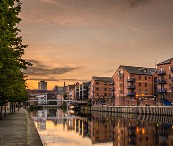 The river Aire sweeping its way through Leeds in West Yorkshire